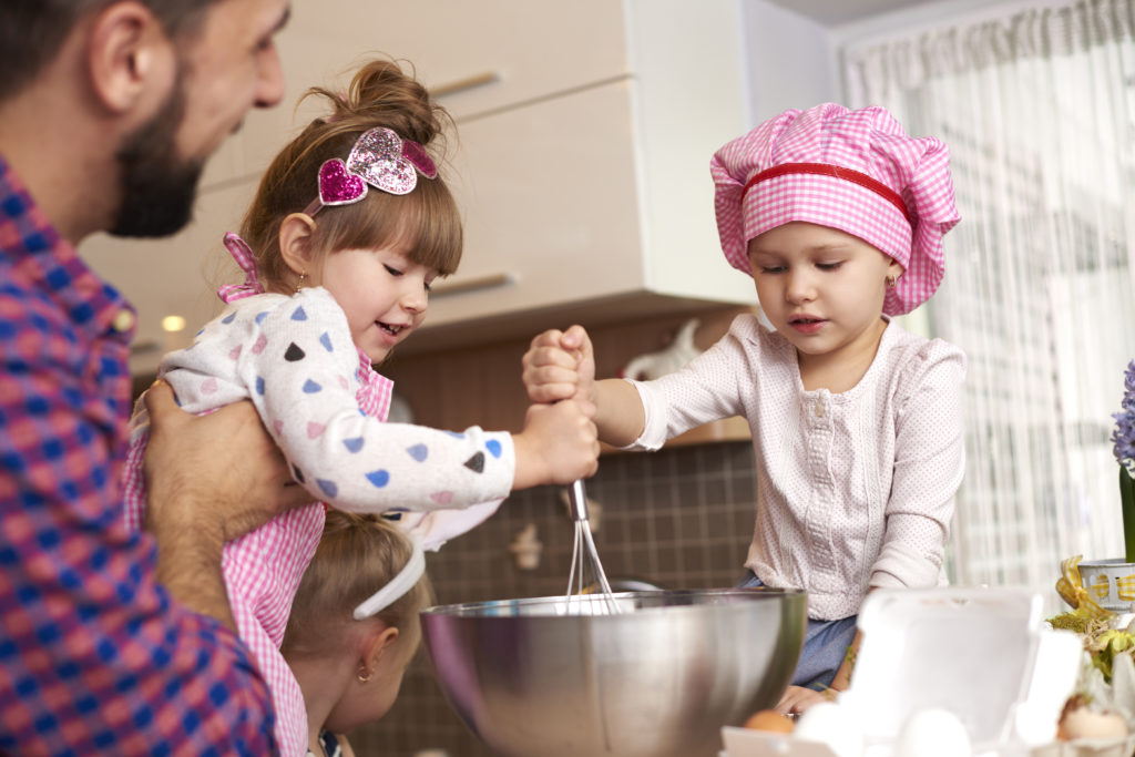 Children cooking with parents